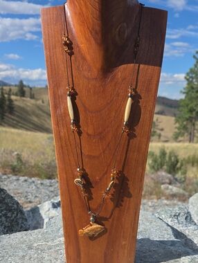 Handcrafted Bone and Bead Necklace with Carved Fish Pendant
